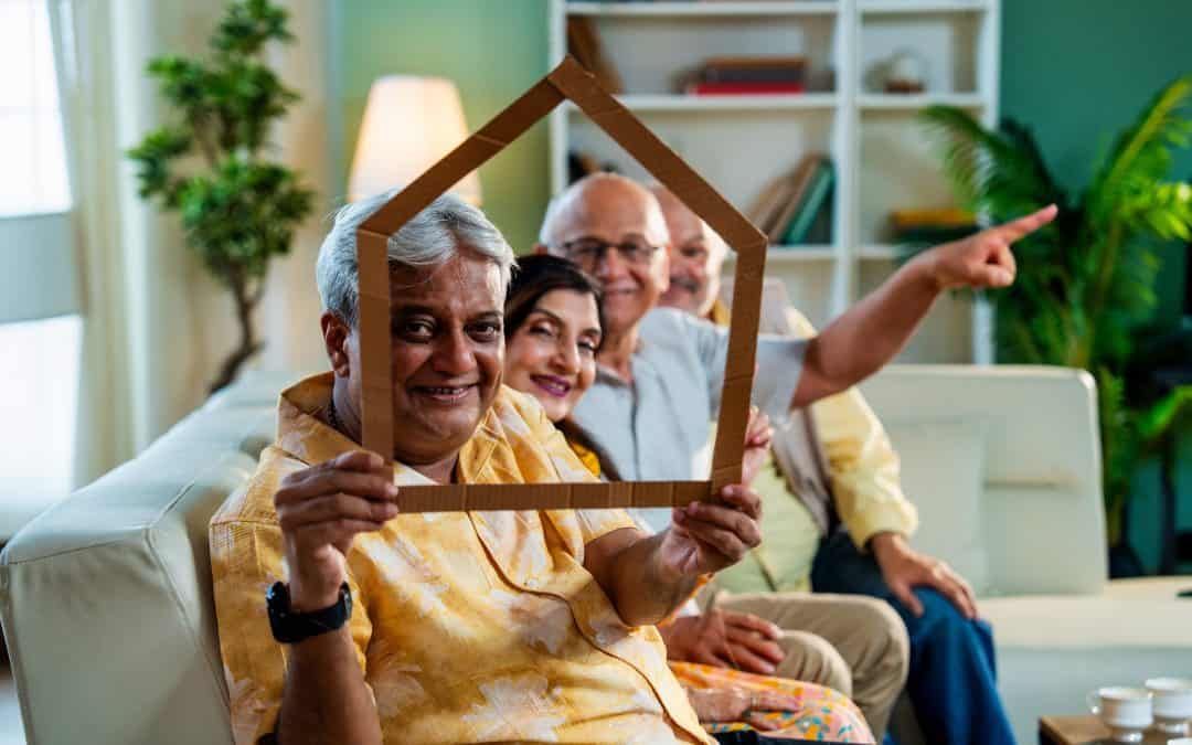 Aging-in-Place Upgrades...-senior-friends-holding-home-cutout-to-convey-old-a-2025 2