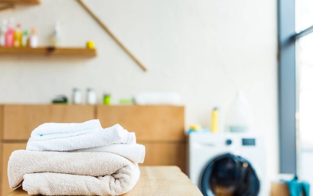 Laundry Room Upgrades...-close-up-view-of-stacked-clean-towels-on-wooden-ta-2024