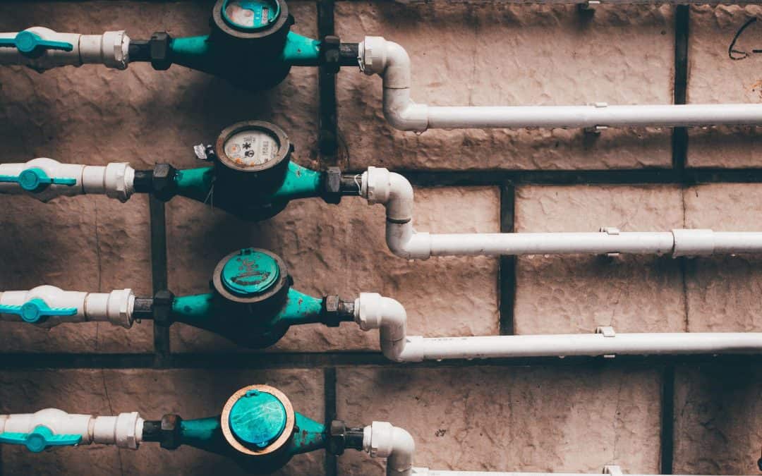 Install Leak Sensors-vertical-shot-of-residential-water-meters-and-pipe-2025